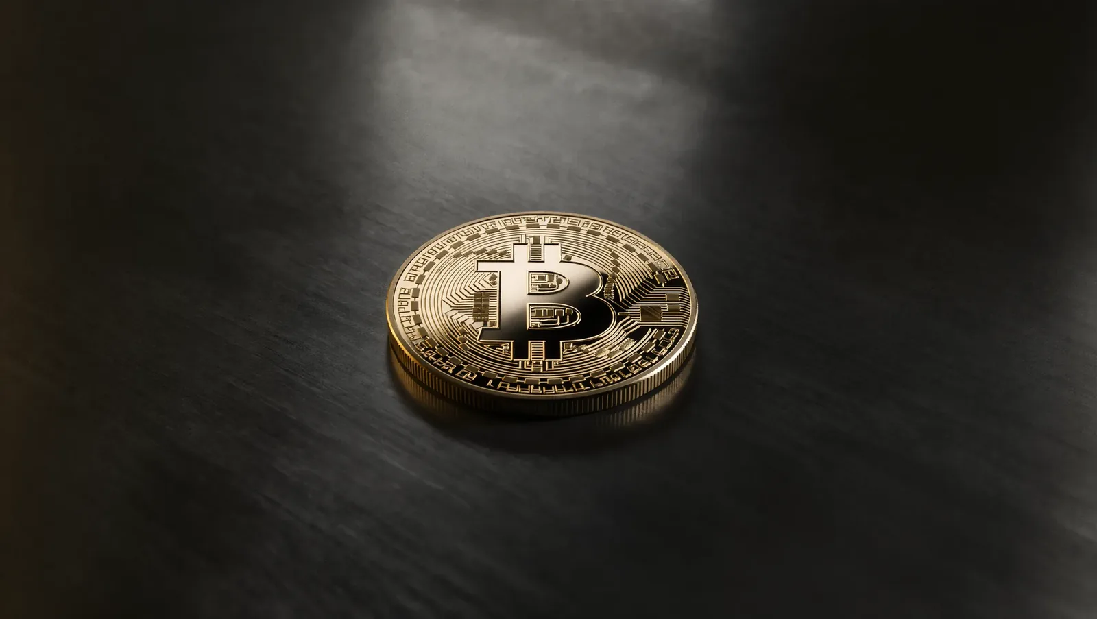 Illustration of a golden bitcoin coin cut in half above a grid of blocks and figures